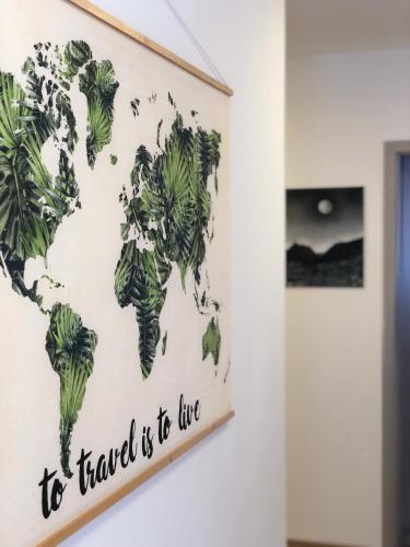 a map of the world hanging on a wall at Gostisce Sovdat in Bovec