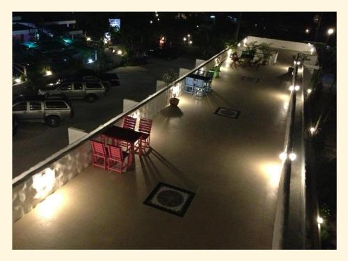an overhead view of a patio at night with lights at BaanChomJan @ Suanphung in Suan Phung