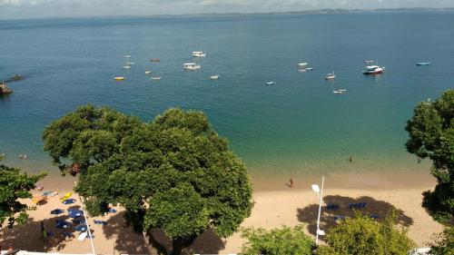 a view of a beach with boats in the water at Hit Hotel in Salvador