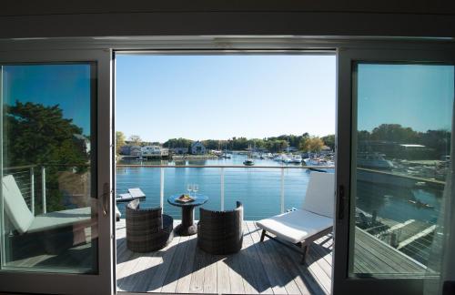 a screened porch with a view of a marina at The Boathouse in Kennebunkport