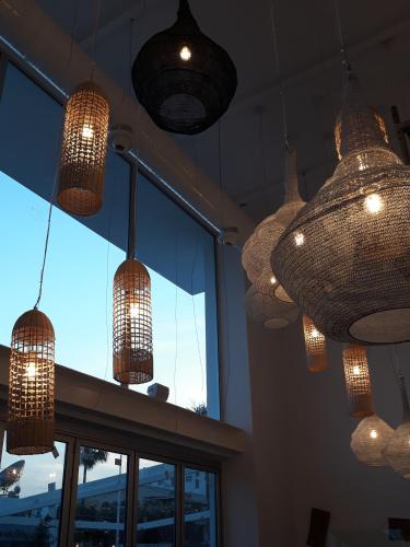 a group of chandeliers hanging from the ceiling at Protaras Plaza Hotel in Protaras