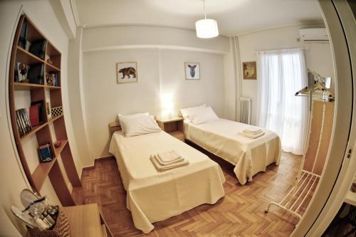 Posteľ alebo postele v izbe v ubytovaní Top Koukaki Location 3rd floor 2bdr