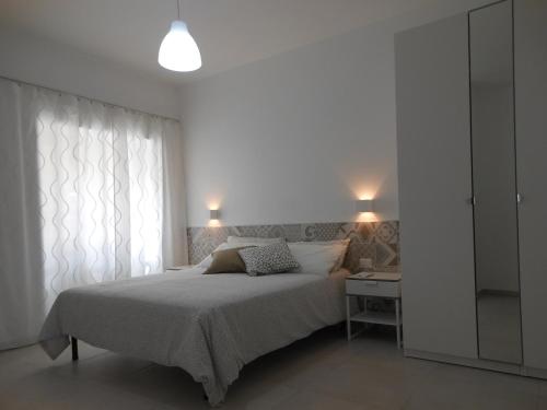 Ένα ή περισσότερα κρεβάτια σε δωμάτιο στο La rosa dei venti