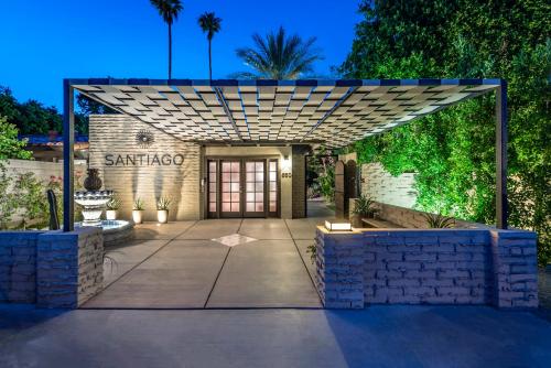 a entrance to a building with a stone wall at Santiago Resort - Palm Springs Premier Gay Men’s Resort in Palm Springs