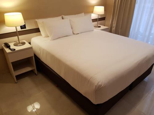 Katil atau katil-katil dalam bilik di Up Recoleta Hotel