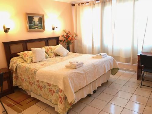 Кровать или кровати в номере Hotel CostaFósil