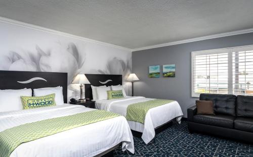 Un pat sau paturi într-o cameră la Dusk Hotel Hollywood