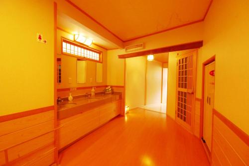 a bathroom with a sink and a mirror at Koyasan Shukubo Saizenin in Koyasan