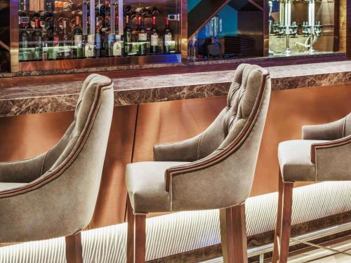 a row of chairs lined up at a bar at Uranus Istanbul Topkapi in Istanbul