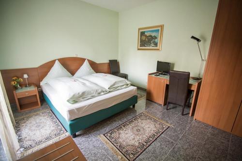 Postel nebo postele na pokoji v ubytování Hotel & Restaurant Garda