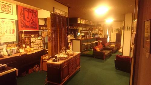 a large room with a store with a lot of furniture at Hotel Mumon in Myoko