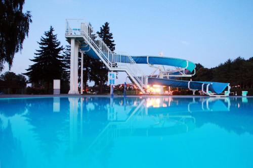 a slide in a swimming pool at night at Gasthof Zur Linde in Neuhofen an der Ybbs