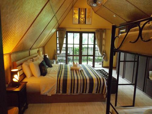Кровать или кровати в номере Homestay Chiangrai