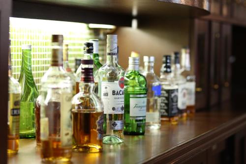 a group of bottles of alcohol sitting on a counter at Hotel New Yokosuka in Yokosuka