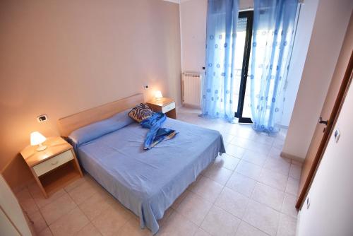 Säng eller sängar i ett rum på Residence Adriatico
