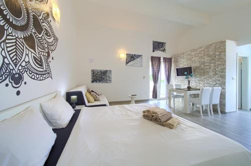 Ένα ή περισσότερα κρεβάτια σε δωμάτιο στο Apartments Mali Nono