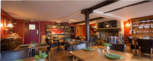a restaurant with tables and chairs and a bar at St.Michaels Bistro in Painswick