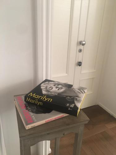 a book sitting on a table next to a door at Luxury My home in Tolentino