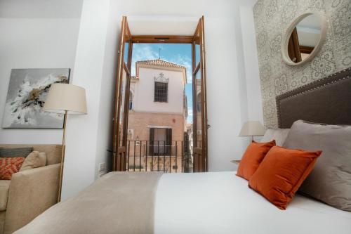 Postel nebo postele na pokoji v ubytování Feelathome Mártires Apartments