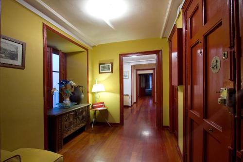 a room that has a door open to a hallway at La Pensión del Camino in Burgos