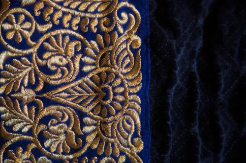 a close up of the embroidery on a blue cloth at St.Michaels Bistro in Painswick