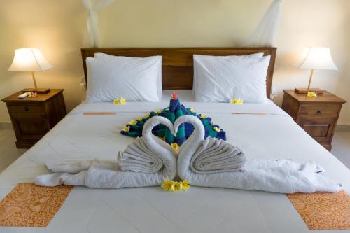 Ένα ή περισσότερα κρεβάτια σε δωμάτιο στο Eka Bali Guest House