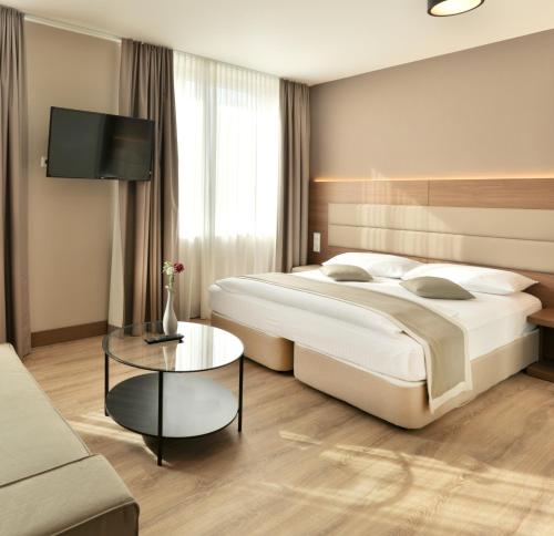 Postel nebo postele na pokoji v ubytování Ocak Aparthotel