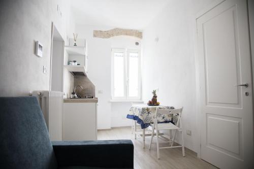 A kitchen or kitchenette at Tre Archi Apartment & Relais