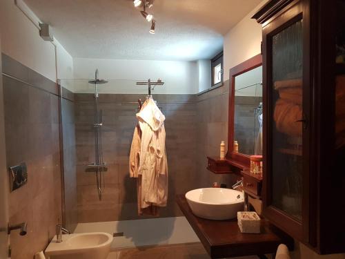 a bathroom with a sink and a shower at La Tavernetta in Aosta