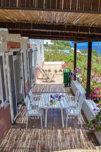 a table and two chairs on a patio at Maridea - Scuncillo in Ponza