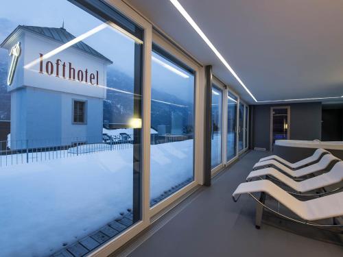 Postel nebo postele na pokoji v ubytování lofthotel Walensee