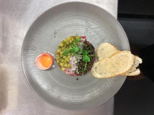 a bowl of food with an egg and bread at The New Inn in Cerne Abbas
