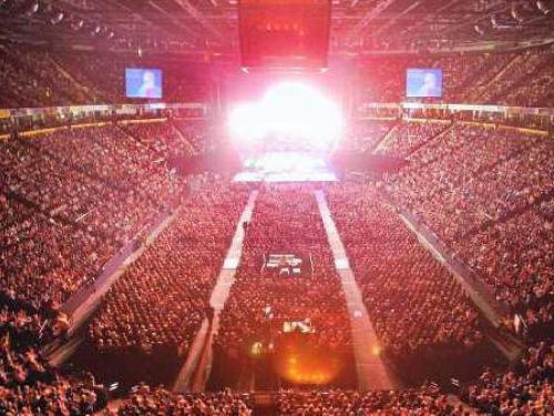 a crowd of people in an arena at a concert at Media City Salford Quays in Manchester
