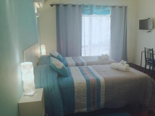 Ένα ή περισσότερα κρεβάτια σε δωμάτιο στο Sensations Guesthouse