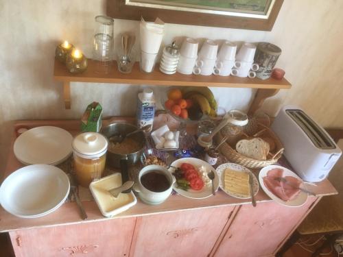 a shelf with a bunch of food on it at Christinagården Guesthouse in Ramsele