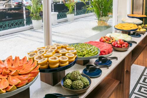 a buffet of fruits and vegetables on a counter at Copacabana Palace, A Belmond Hotel, Rio de Janeiro in Rio de Janeiro