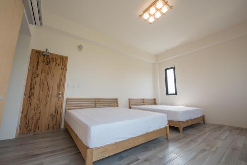 Here Homestayにあるベッド
