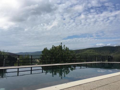 a swimming pool with a view of the mountains at B&B Zia Nì in Peschici
