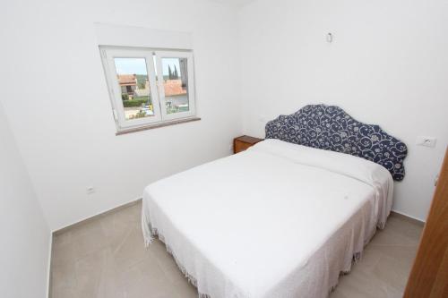 Ένα ή περισσότερα κρεβάτια σε δωμάτιο στο Apartment Mihaela