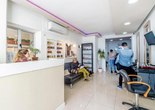 a group of people in a waiting room at Alborada Apart Hotel in Sliema