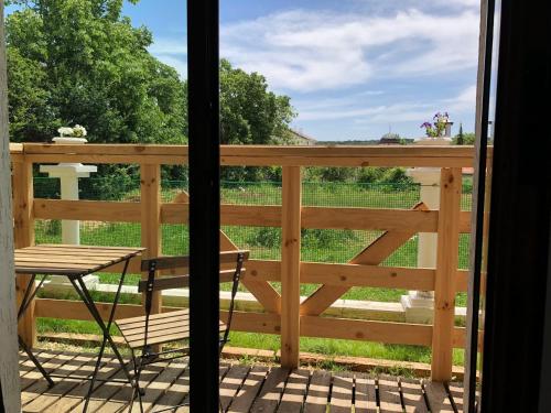 a view from a porch with a table and a chair at Villa Adrian in Shkorpilovtsi