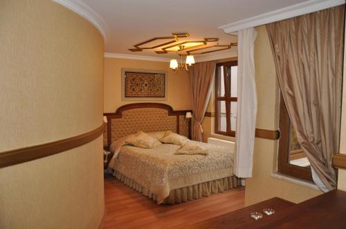 Ένα ή περισσότερα κρεβάτια σε δωμάτιο στο Aruna Boutique Hotel