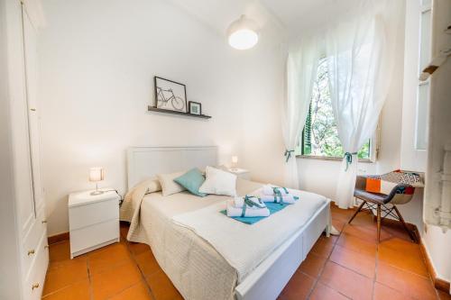 En eller flere senge i et værelse på Villa Cosimo