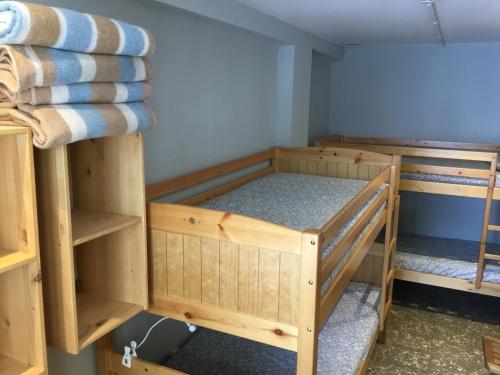 a room with two bunk beds in it at Xalet-Refugi U.E.C. in La Molina