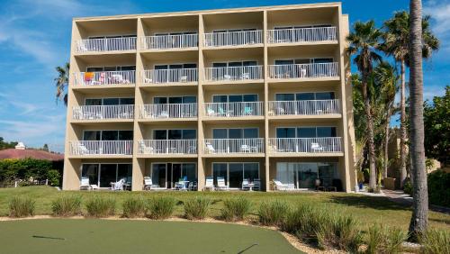 a view of the hotel from the beach at Beach and sunset view from your balcony in Longboat Key