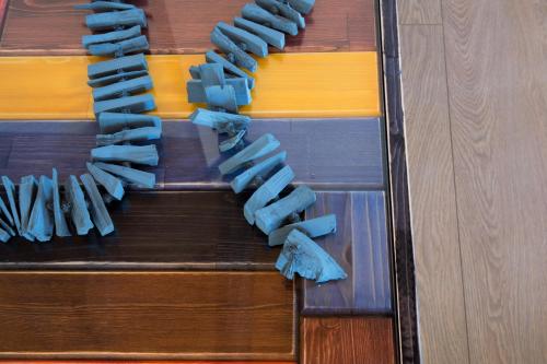 a group of ties on a wooden table at Villa Ioanna by Pelion Esties in Áno Gatzéa