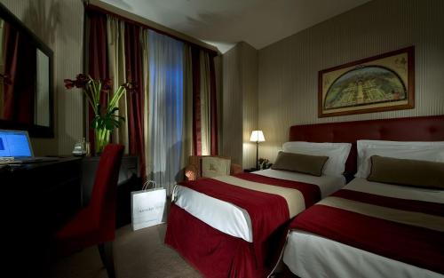 Llit o llits en una habitació de Hotel dei Borgognoni