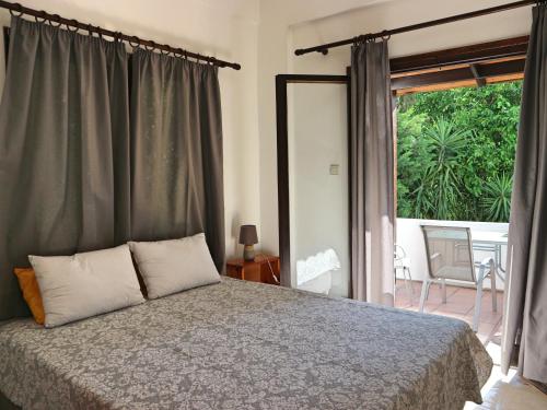 Posteľ alebo postele v izbe v ubytovaní Oliaria Apartments