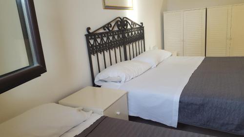 Säng eller sängar i ett rum på la casa di Franca