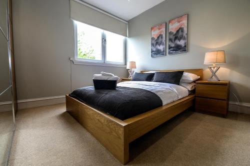 a bedroom with a bed and a window at Apartment F in Aberdeen